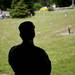 A member of the Washtenaw County Honor Guard looks on from the shade before presenting the 21 gun salute on Sunday, May 26. Daniel Brenner I AnnArbor.com